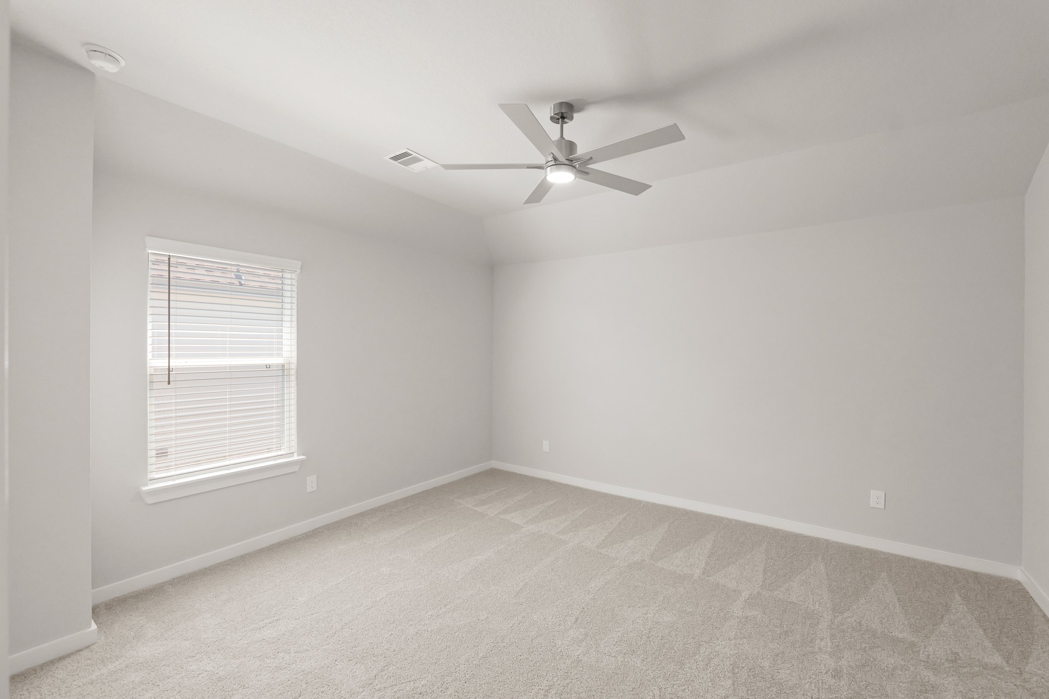 4603 Whisperwood Drive Rosenberg, TX 77471 - Photo 37 of 50 an empty room with a window and ceiling fan