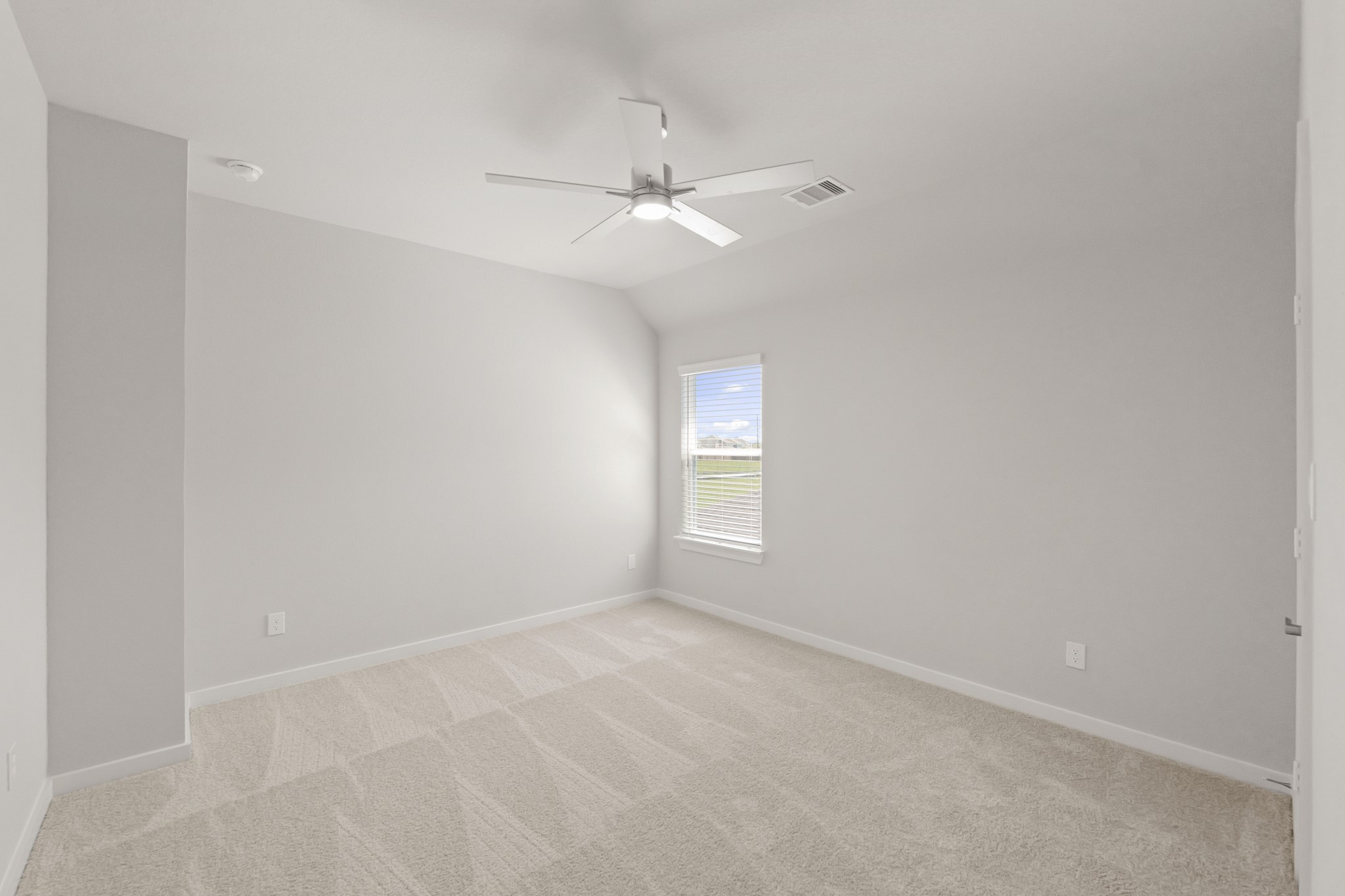 4603 Whisperwood Drive Rosenberg, TX 77471 - Photo 39 of 50 an empty room with a window and ceiling fan