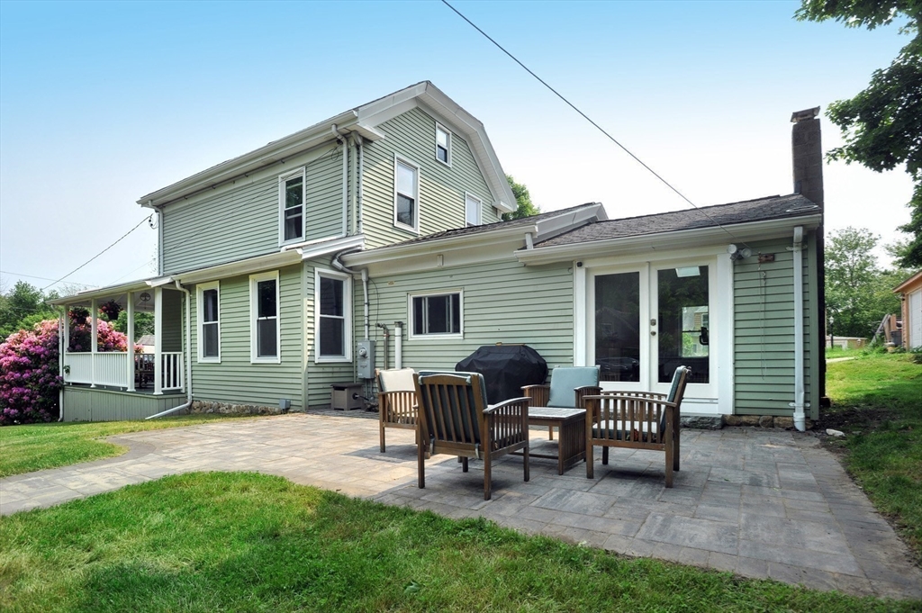 198 Hull Street Hingham, MA 02043 - Photo 12 of 15 a view of a house with a backyard and sitting area