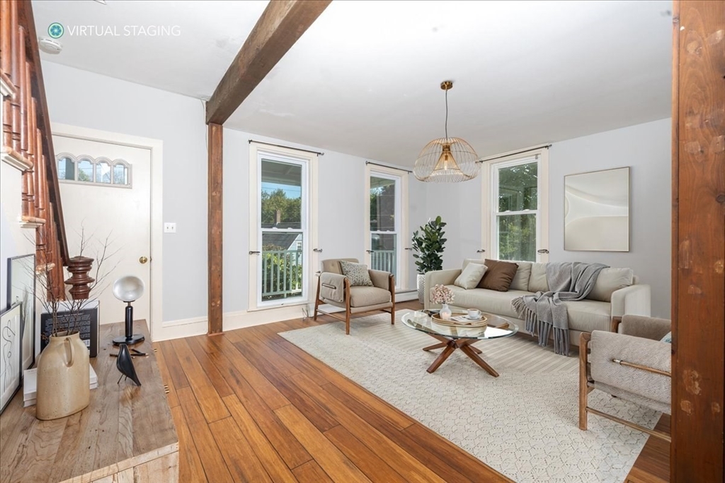 198 Hull Street Hingham, MA 02043 - Photo 5 of 15 a living room with furniture a window and a chandelier