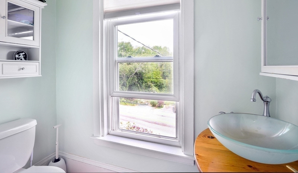 198 Hull Street Hingham, MA 02043 - Photo 10 of 15 a bathroom with a sink and a mirror