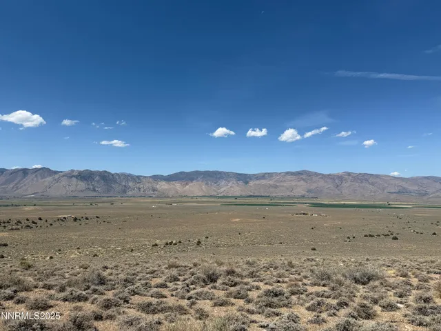 a view of a lake with mountains in the background