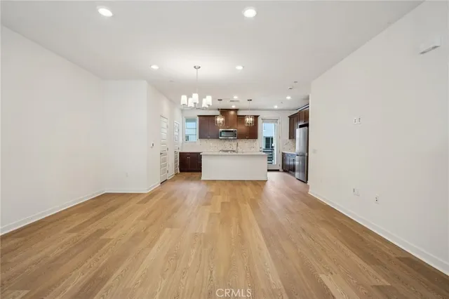 a view of kitchen and wooden floor