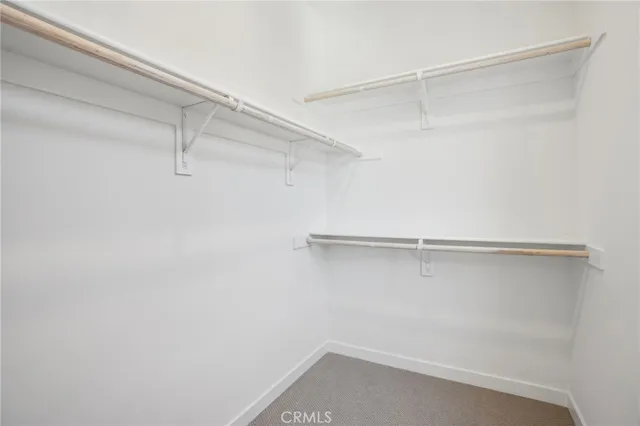 a bathroom with a shower sink vanity granite and mirror