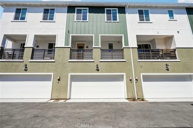 a view of hall with furniture and windows