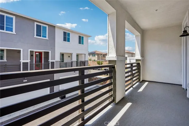 swimming pool with outdoor seating and lots of buildings