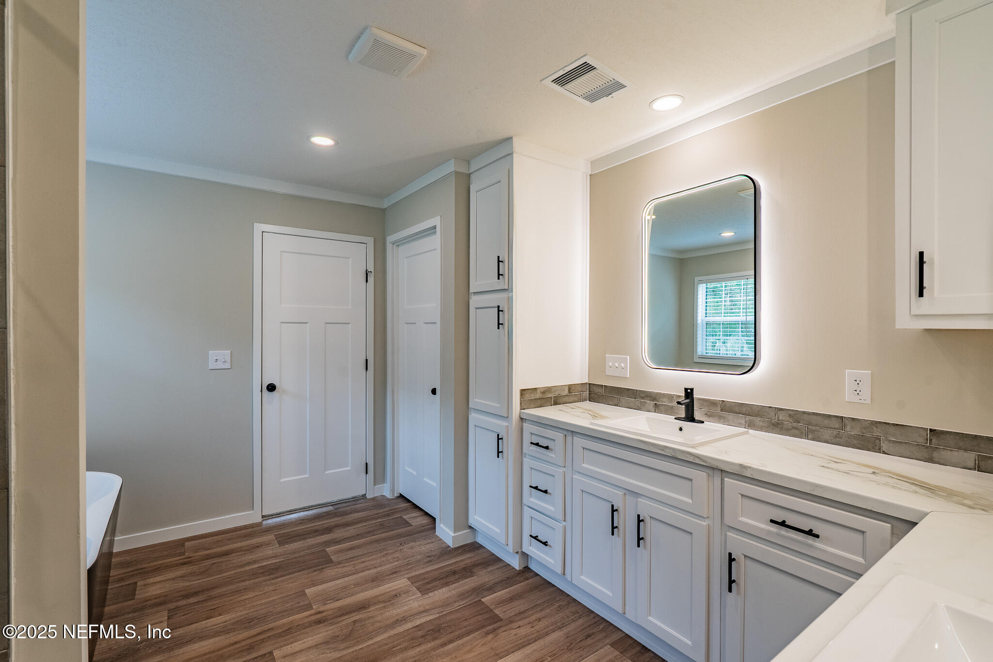 54405 Lee Stoner Road East Callahan, FL 32011 - Photo 13 of 24 a bathroom with a sink and a mirror