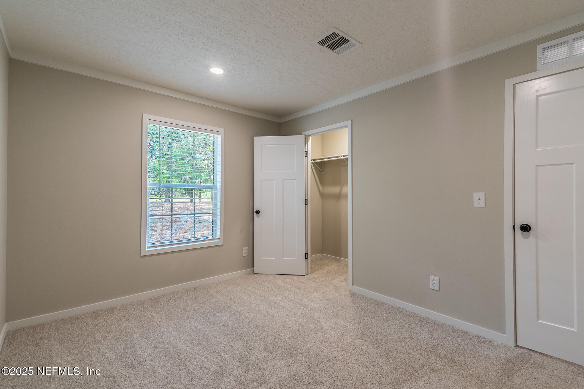 54405 Lee Stoner Road East Callahan, FL 32011 - Photo 16 of 24 an empty room with windows and closet