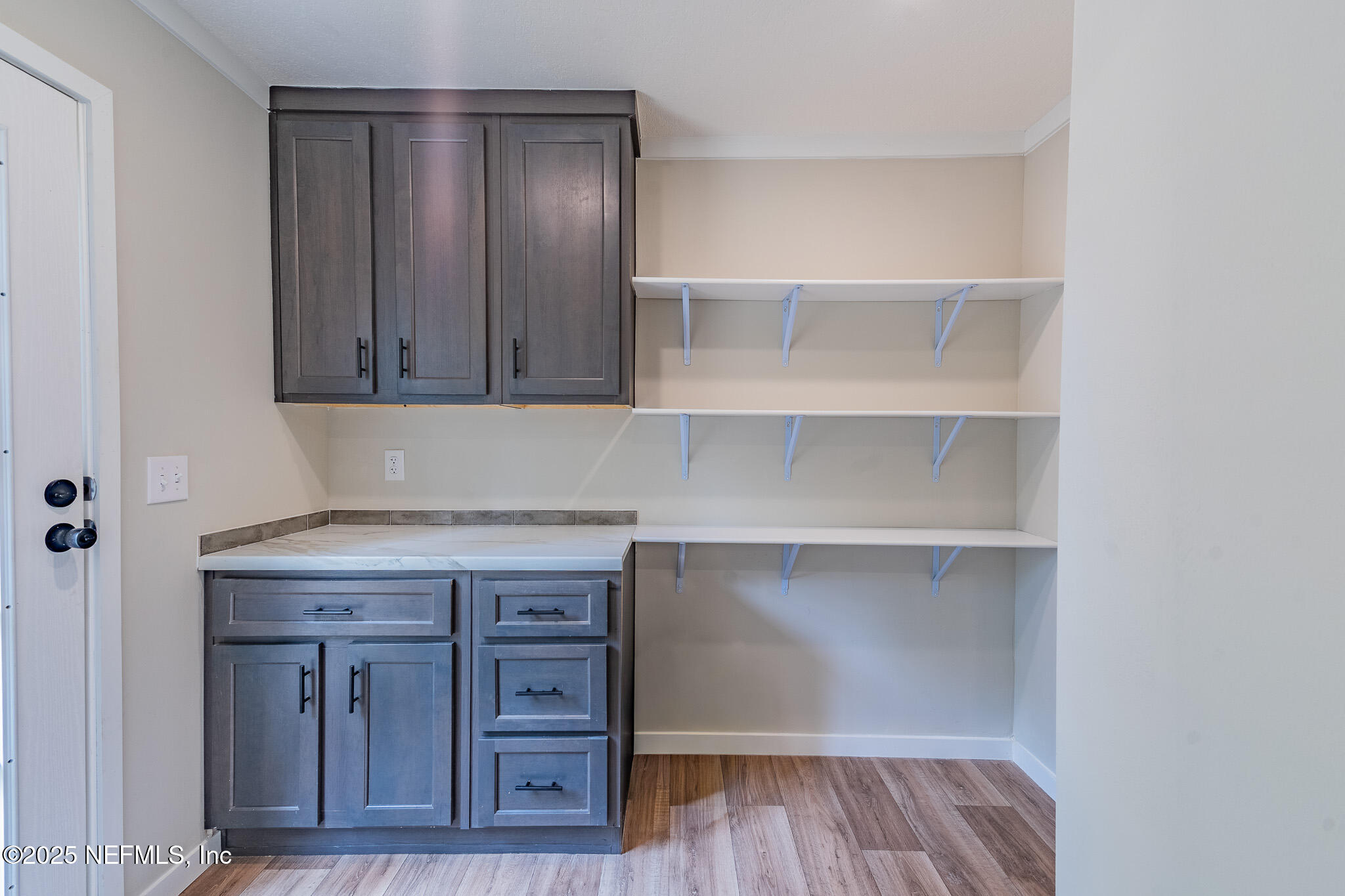 54405 Lee Stoner Road East Callahan, FL 32011 - Photo 22 of 24 a view of cabinets and wooden floor