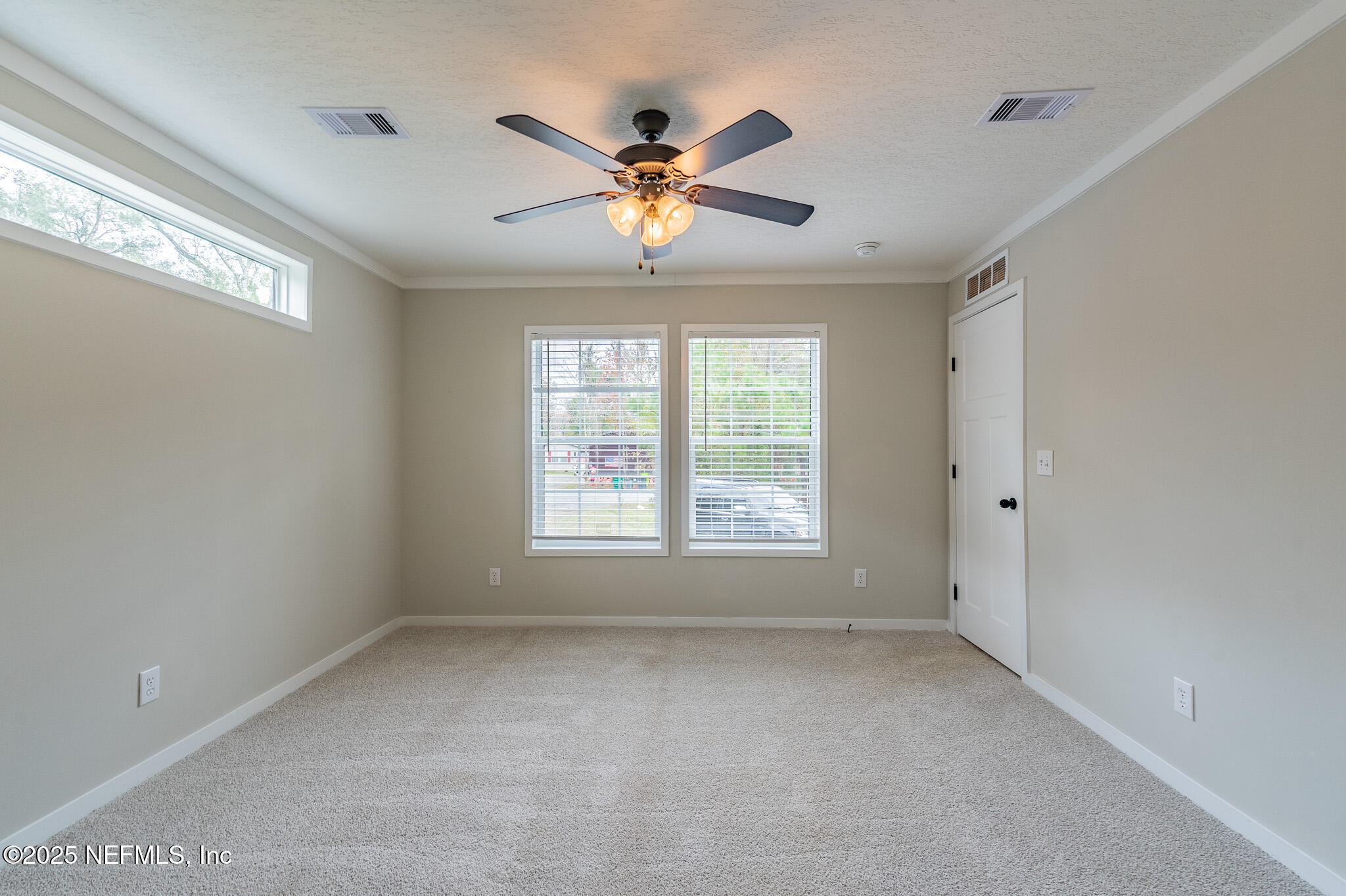 54405 Lee Stoner Road East Callahan, FL 32011 - Photo 9 of 24 a view of a livingroom with a ceiling fan and window