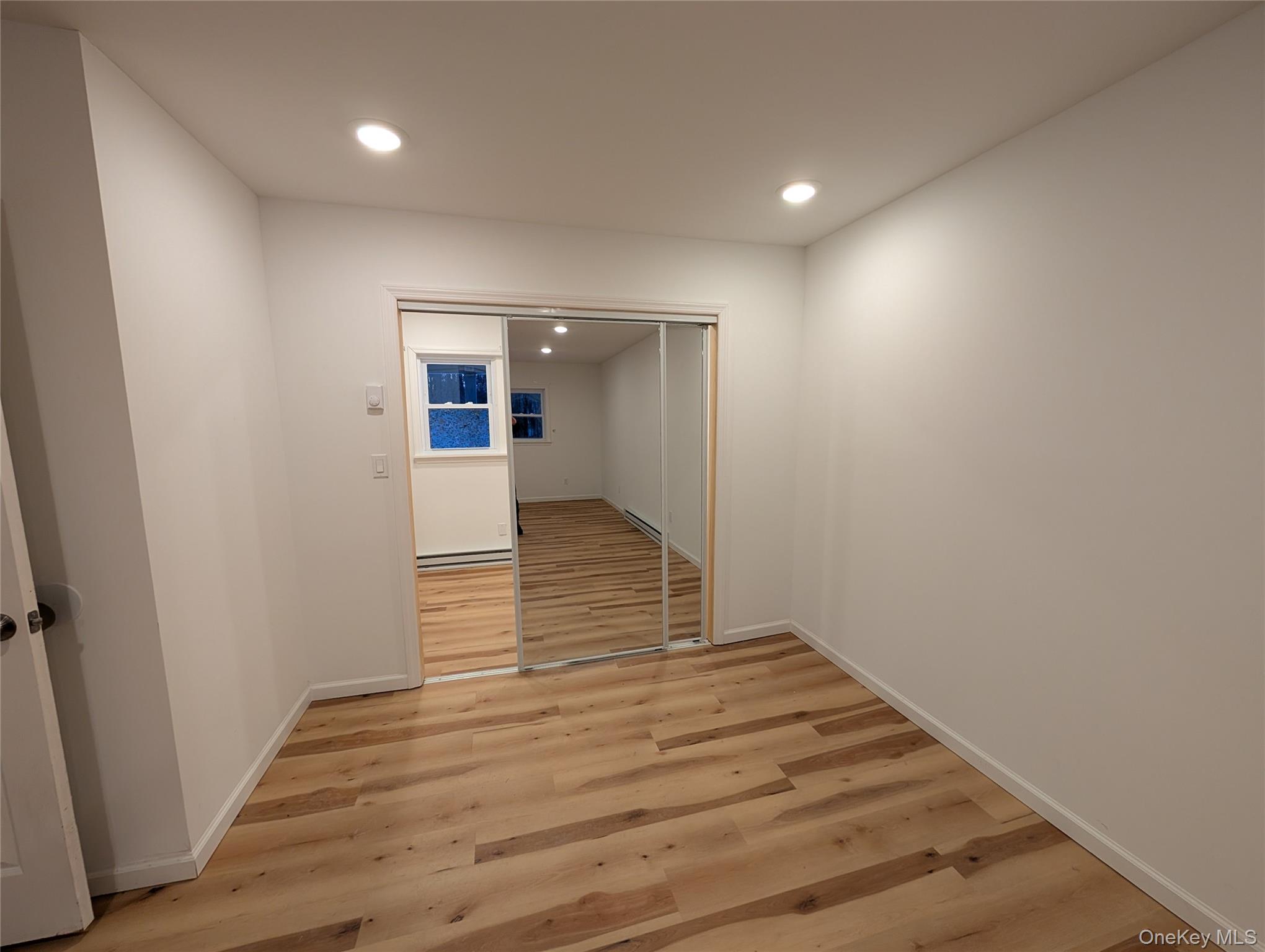 1407 Highway 208 Wallkill, NY 12589 - Photo 17 of 42 sliding mirrored glass doors to bonus room, inside primary bedroom