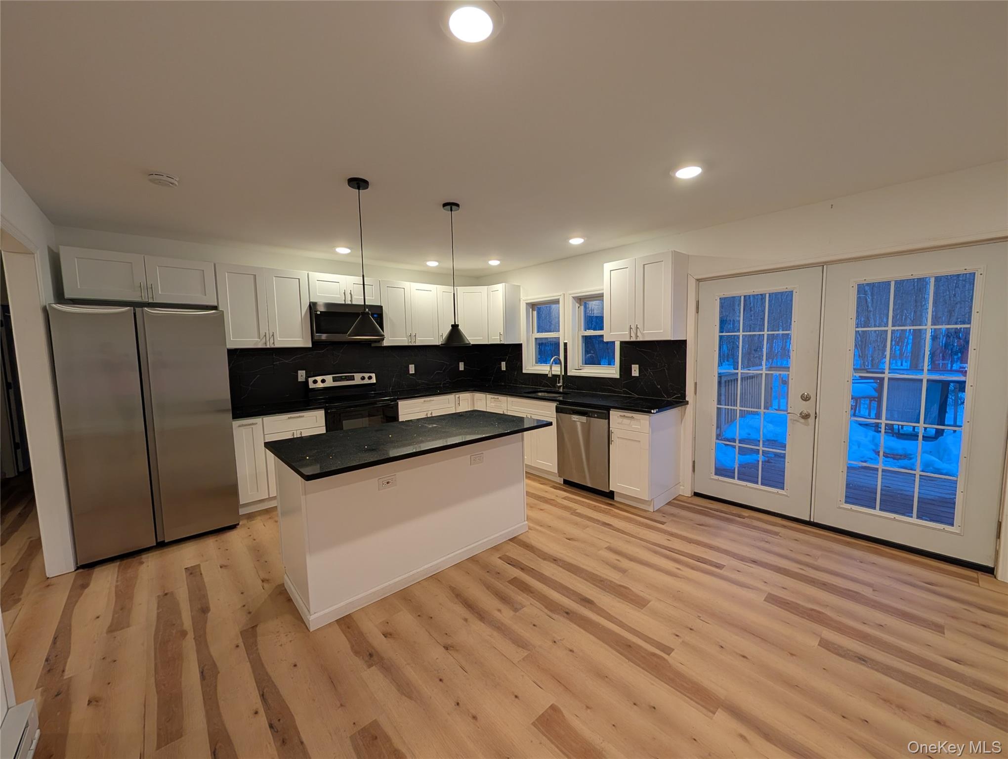 1407 Highway 208 Wallkill, NY 12589 - Photo 7 of 42 Doors to deck from kitchen