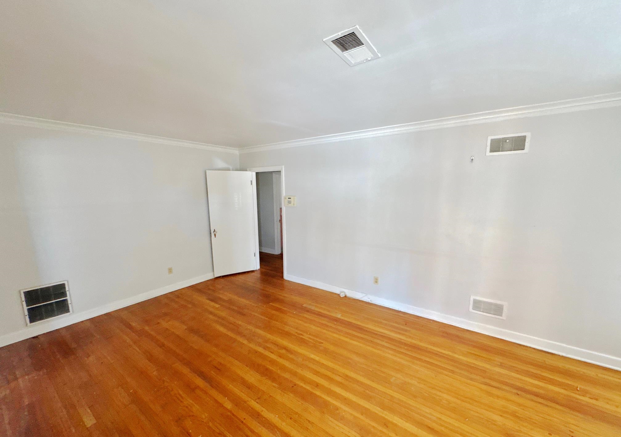 1454 Railton Road Memphis, TN 38111 - Photo 3 of 10 a view of empty room with wooden floor