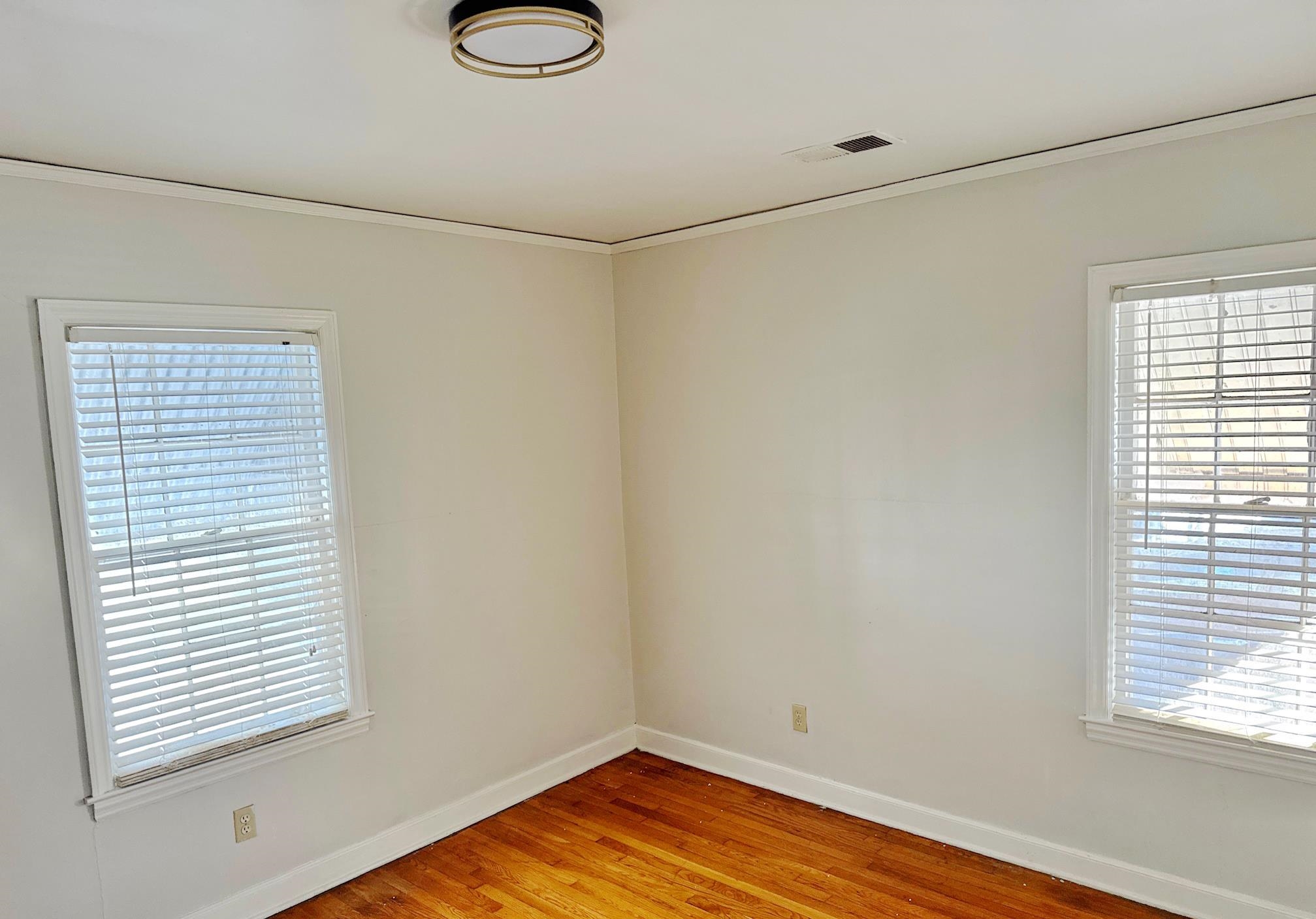 1454 Railton Road Memphis, TN 38111 - Photo 6 of 10 a view of a room with wooden floor and a window