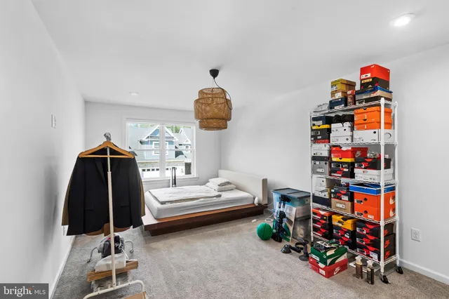 a bedroom with bed and a window