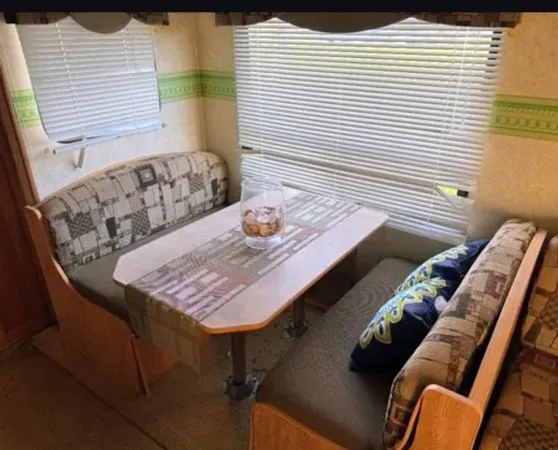 a view of a balcony with two chairs and a table