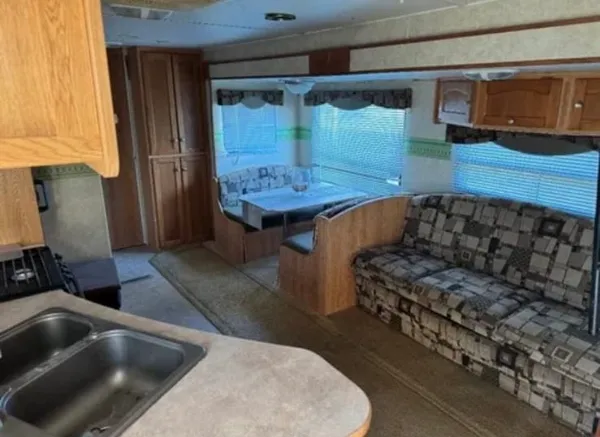 a bathroom with a bathtub and a window