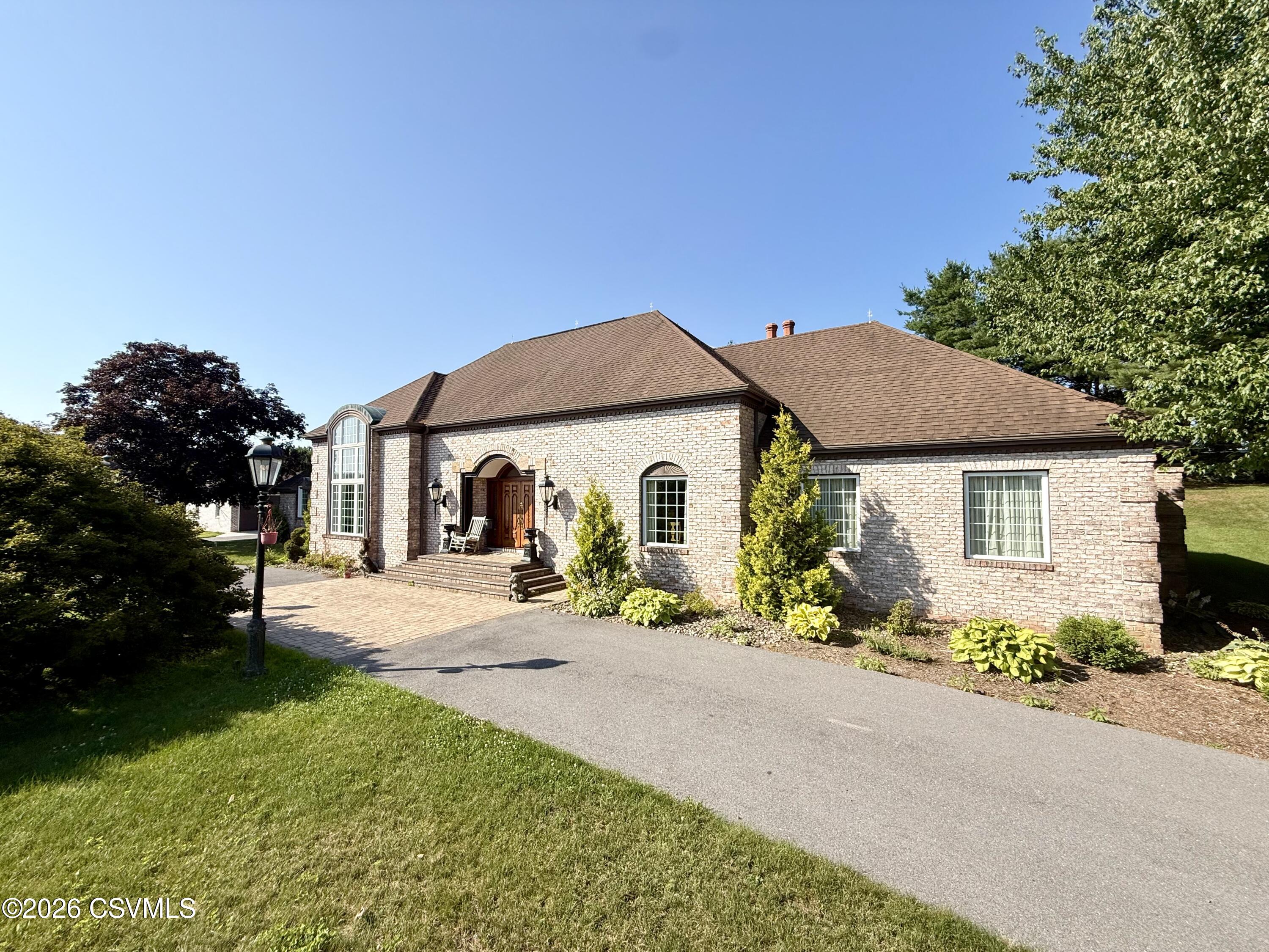 50 Sweet Gum Road Selinsgrove, PA 17870 - Photo 5 of 82 a front view of a house with a yard and potted plants