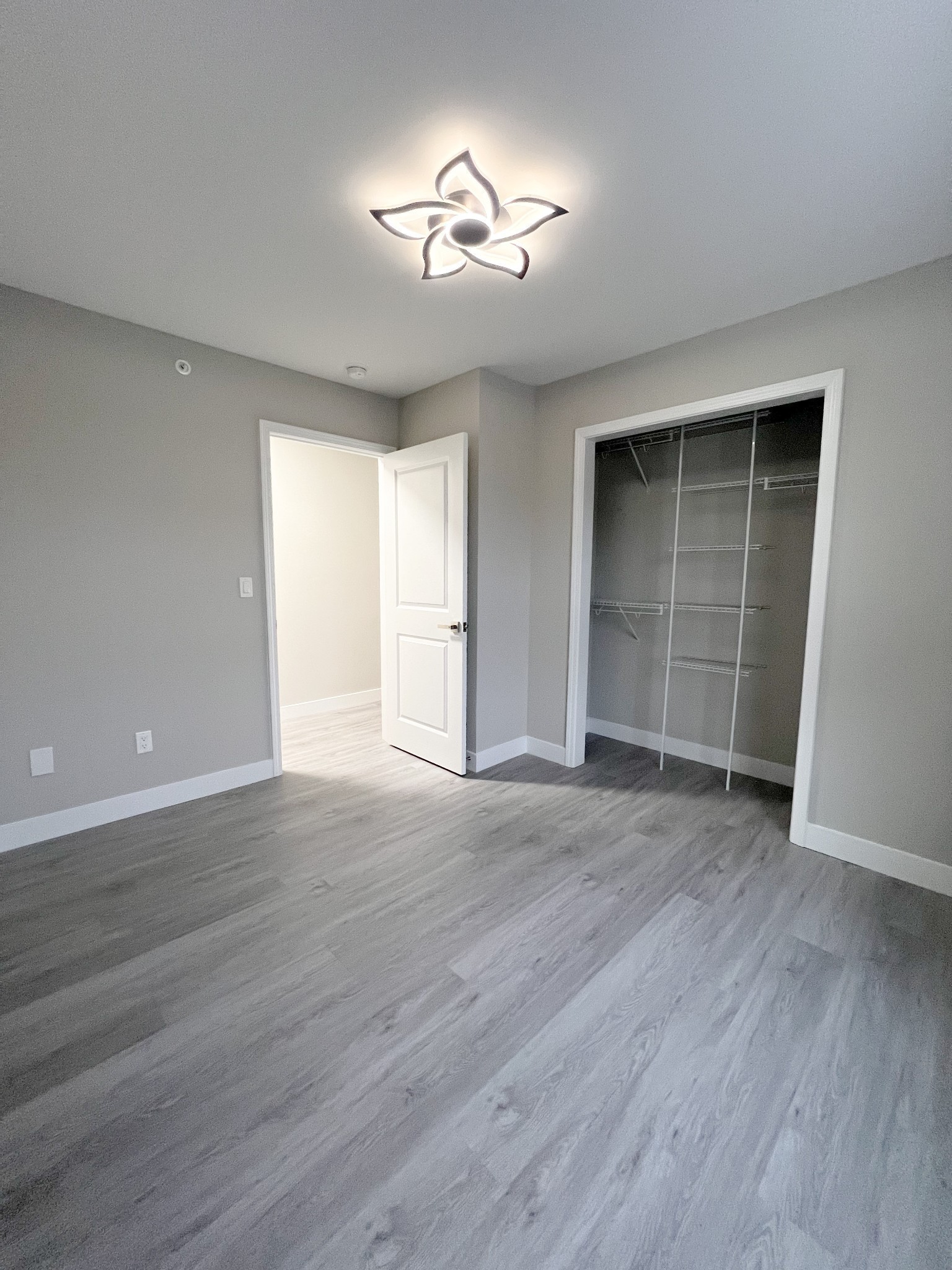 543 Peachers Mill Road, Unit 213 Clarksville, TN 37042 - Photo 13 of 21 a view of empty room with wooden floor and fan