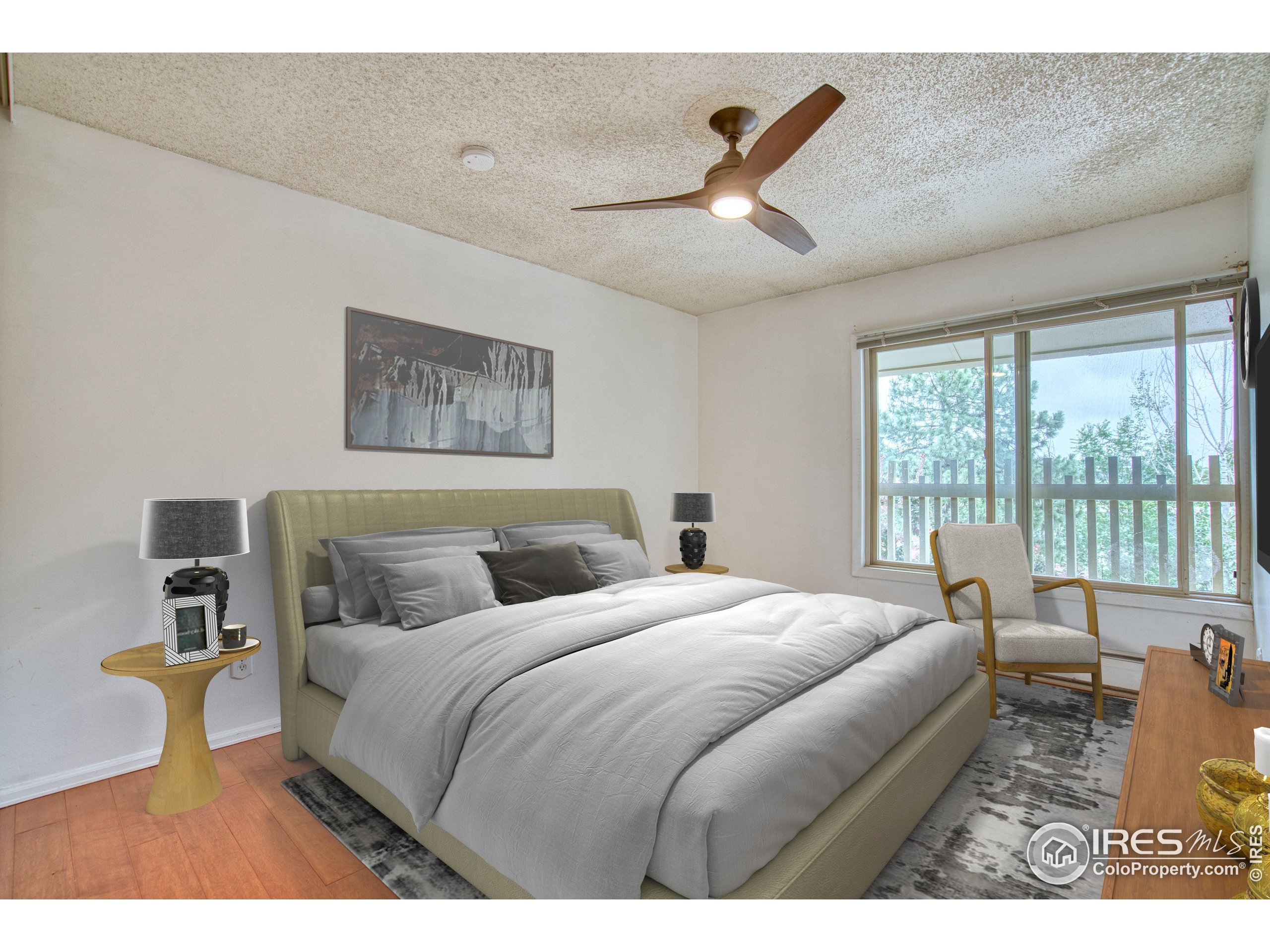 2707 Valmont Road, Unit 304 Boulder, CO 80304 - Photo 13 of 18 a bedroom with a large bed and a large window