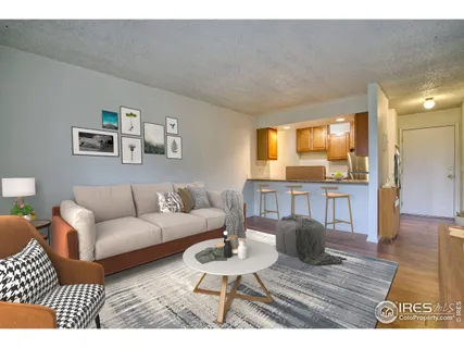 a living room with furniture and a table