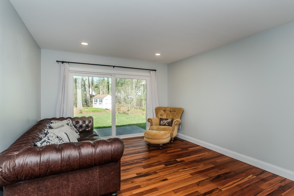 21 Shattuck Road Hadley, MA 01035 - Photo 19 of 42 a living room with furniture and a floor to ceiling window