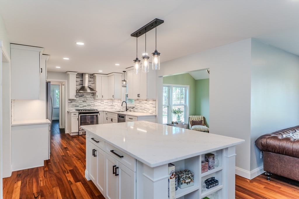 21 Shattuck Road Hadley, MA 01035 - Photo 22 of 42 a kitchen with stainless steel appliances granite countertop a sink a stove and a refrigerator