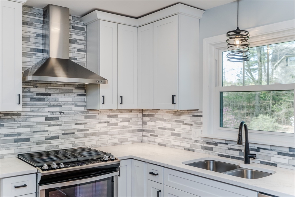 21 Shattuck Road Hadley, MA 01035 - Photo 24 of 42 a kitchen with stainless steel appliances a sink stove and cabinets