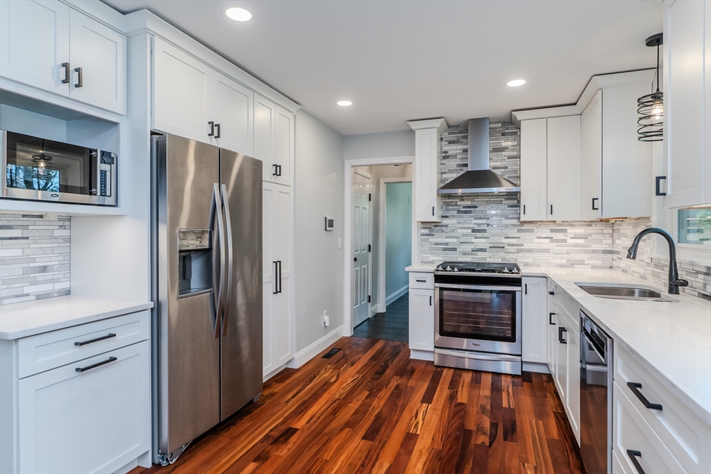 21 Shattuck Road Hadley, MA 01035 - Photo 25 of 42 a kitchen with stainless steel appliances a stove sink and refrigerator