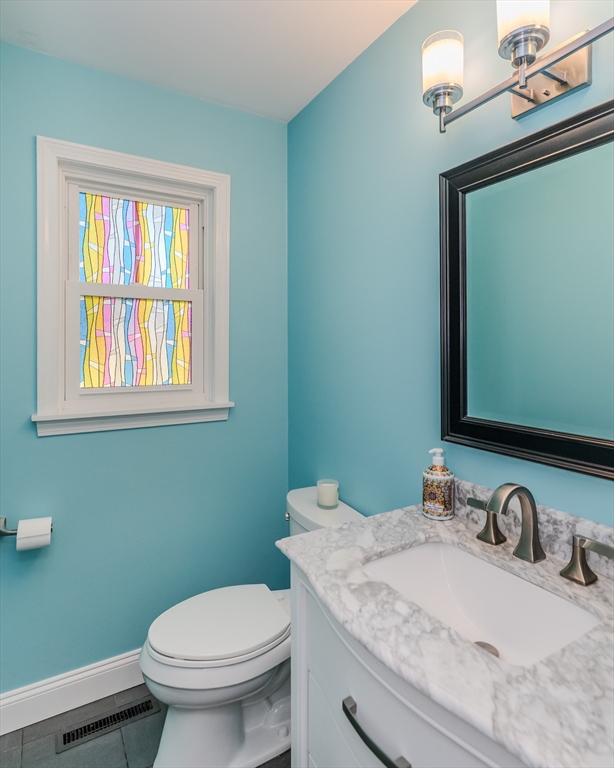 21 Shattuck Road Hadley, MA 01035 - Photo 31 of 42 a bathroom with a granite countertop toilet sink and mirror