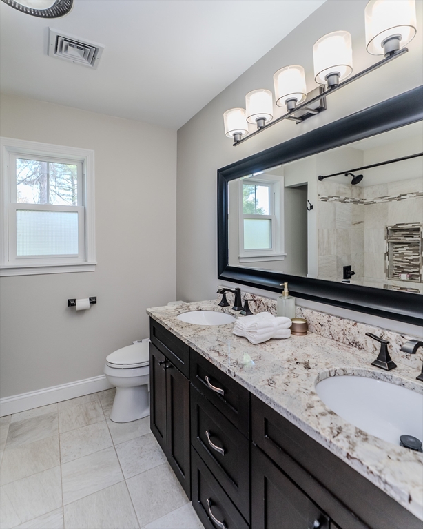 21 Shattuck Road Hadley, MA 01035 - Photo 41 of 42 a bathroom with a toilet sink and mirror
