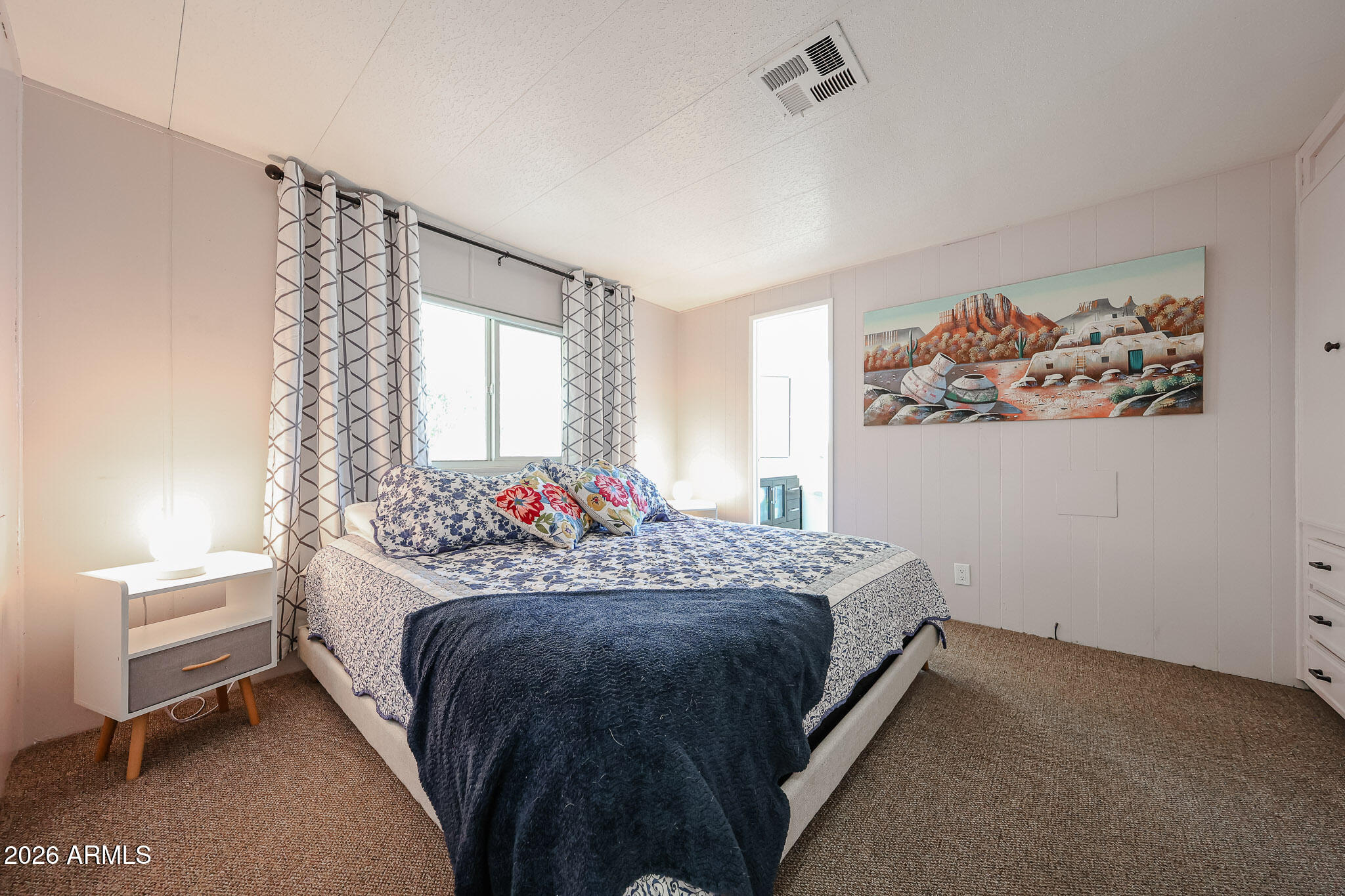 3104 East Broadway Road, Unit 216 Mesa, AZ 85204 - Photo 20 of 37 a bedroom with a bed and a window