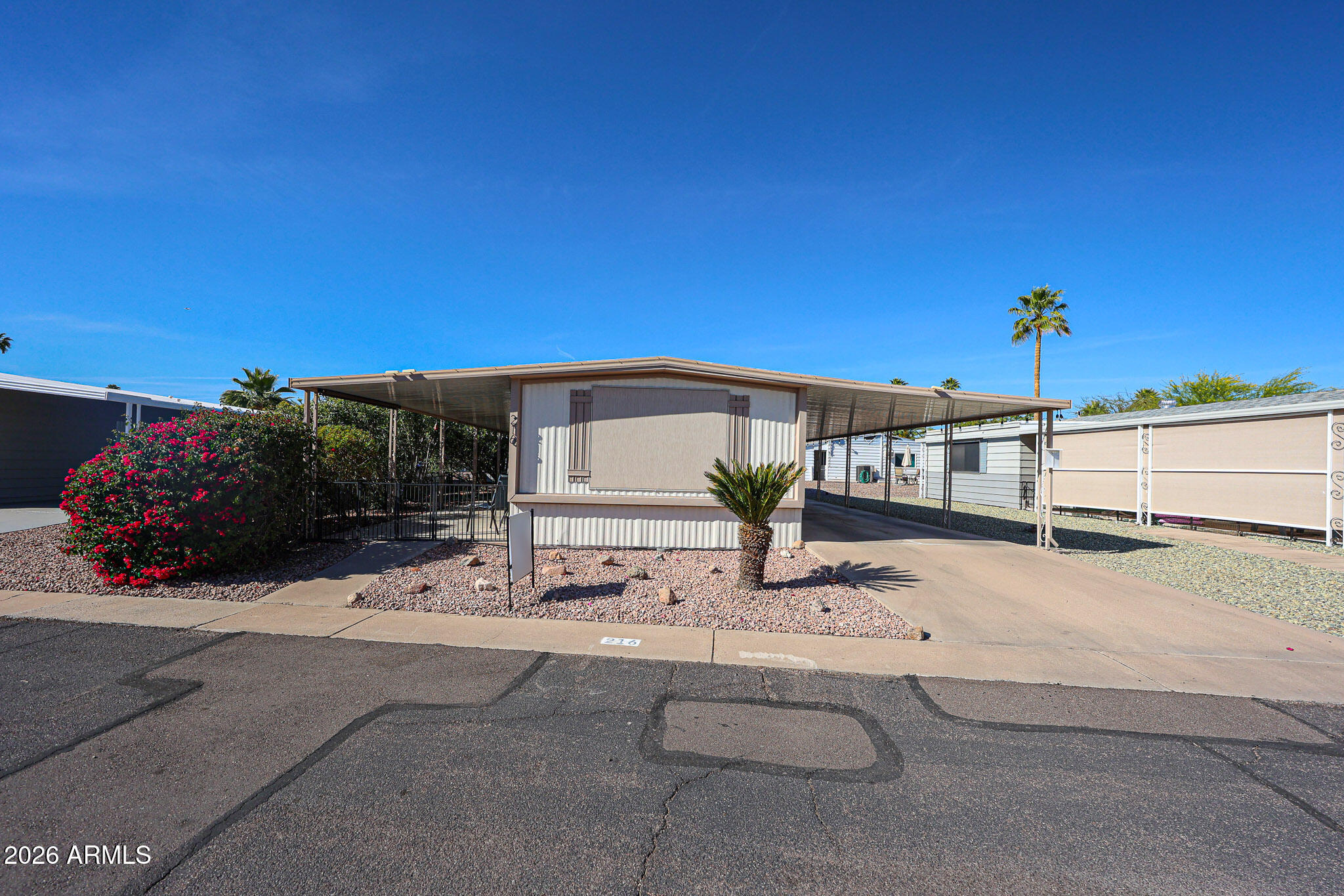 3104 East Broadway Road, Unit 216 Mesa, AZ 85204 - Photo 2 of 37 a view of a house with a patio