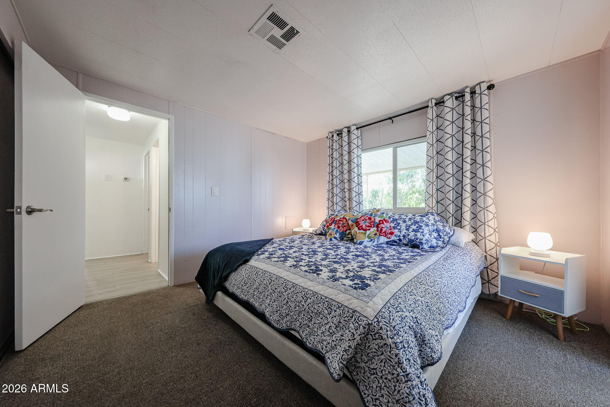 3104 East Broadway Road, Unit 216 Mesa, AZ 85204 - Photo 21 of 37 a bedroom with a bed and a window