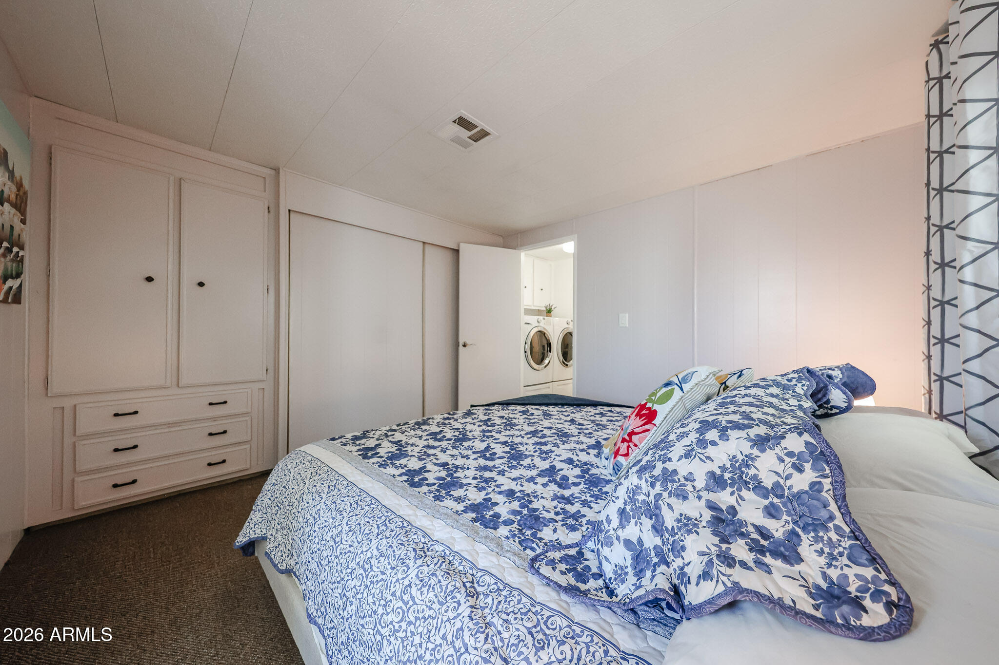 3104 East Broadway Road, Unit 216 Mesa, AZ 85204 - Photo 22 of 37 a bedroom with a bed and a window