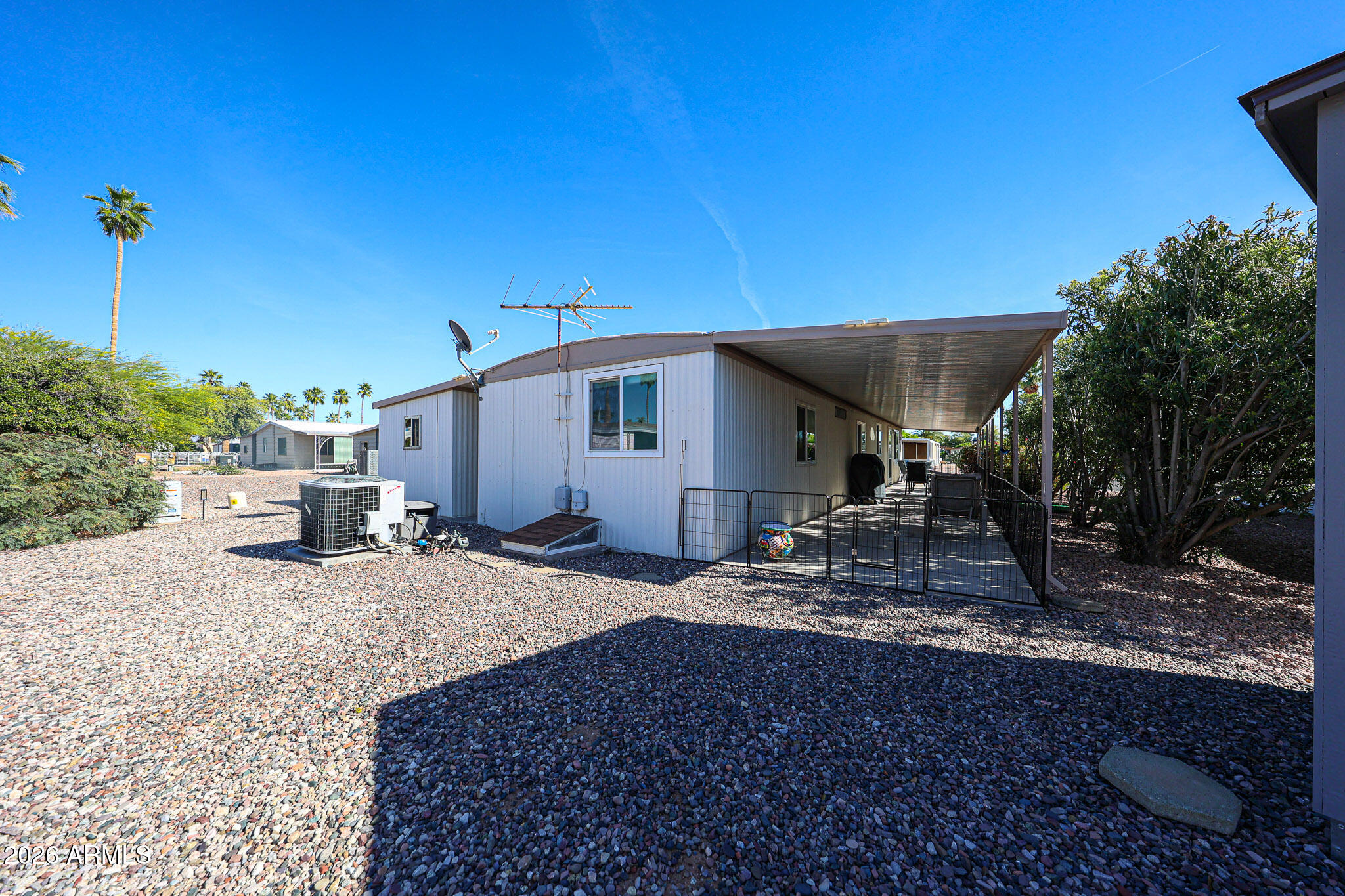 3104 East Broadway Road, Unit 216 Mesa, AZ 85204 - Photo 26 of 37 a view of a house with backyard