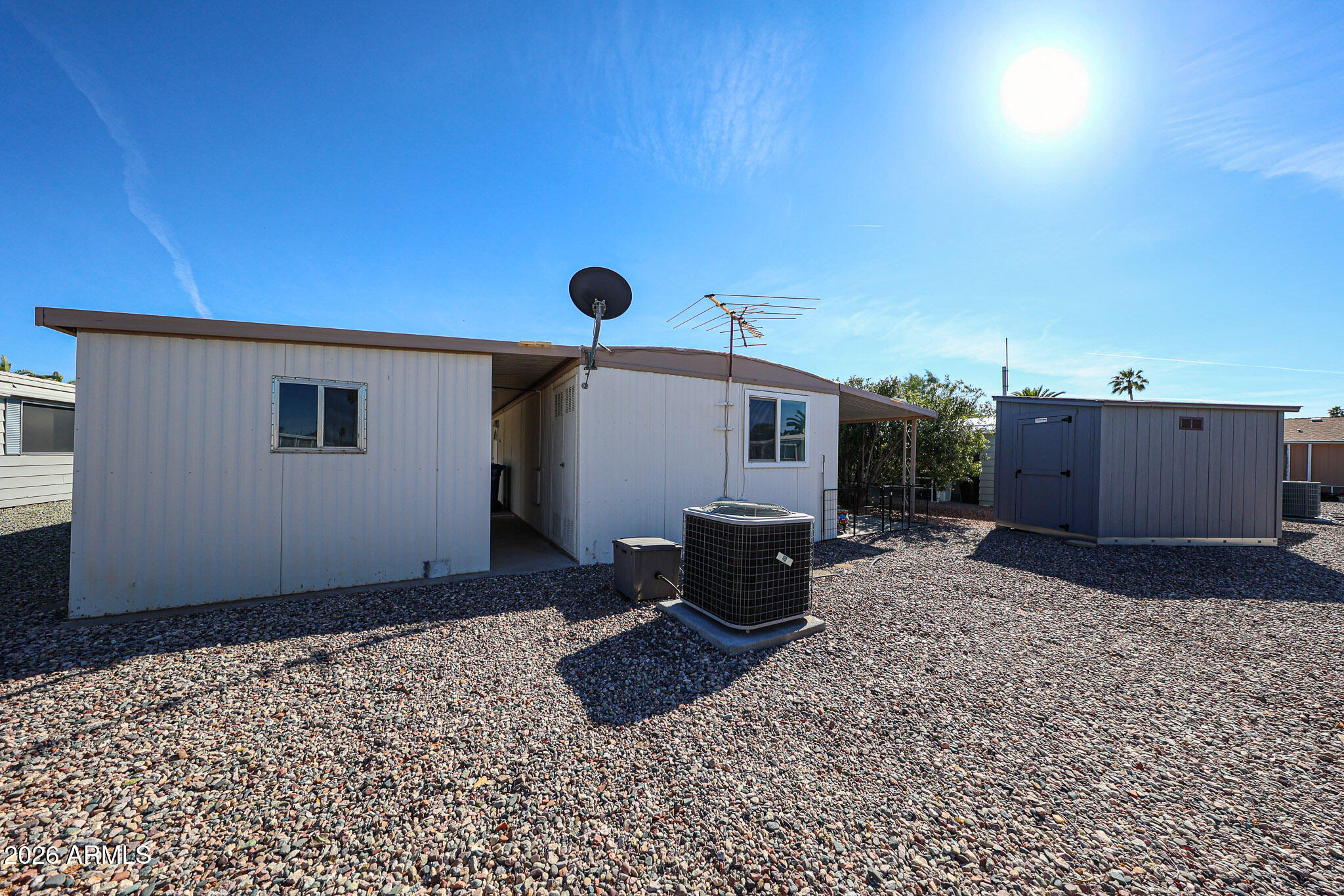 3104 East Broadway Road, Unit 216 Mesa, AZ 85204 - Photo 27 of 37 a backyard of a house with table and chairs