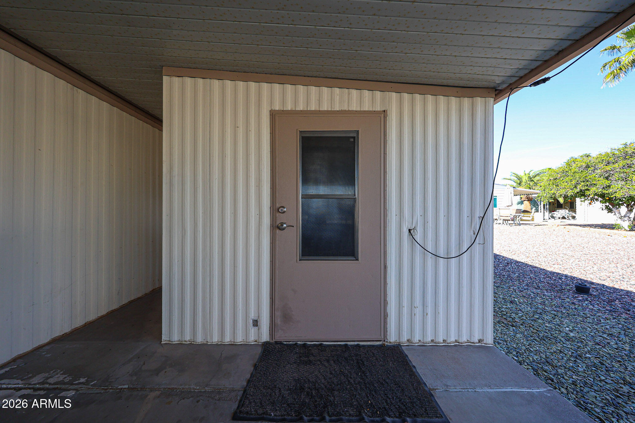 3104 East Broadway Road, Unit 216 Mesa, AZ 85204 - Photo 28 of 37 a view of a door and wooden floor