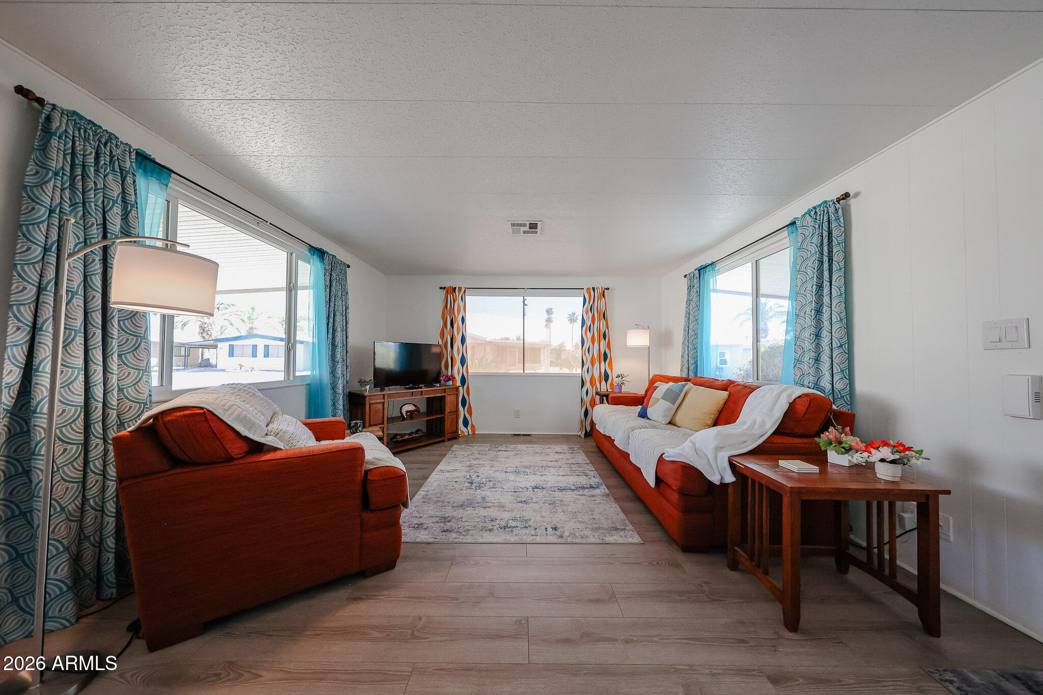 3104 East Broadway Road, Unit 216 Mesa, AZ 85204 - Photo 4 of 37 a living room with furniture and a window