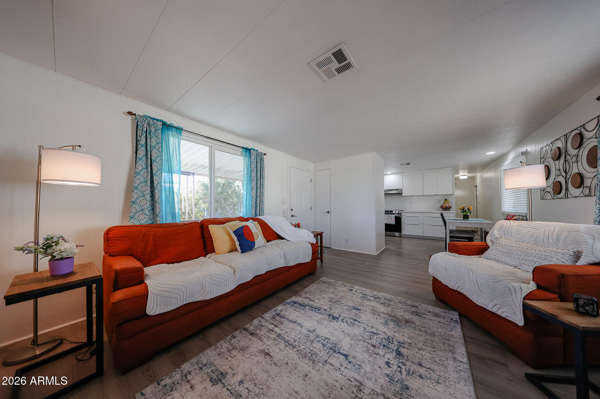 3104 East Broadway Road, Unit 216 Mesa, AZ 85204 - Photo 7 of 37 a living room with furniture and a large window