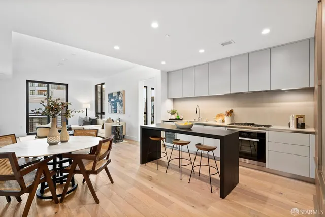 a kitchen with a table and chairs in it