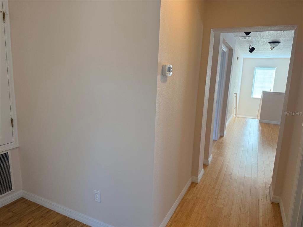 963 North Jacks Lake Road Clermont, FL 34711 - Photo 27 of 39 a view of a hallway with wooden floor