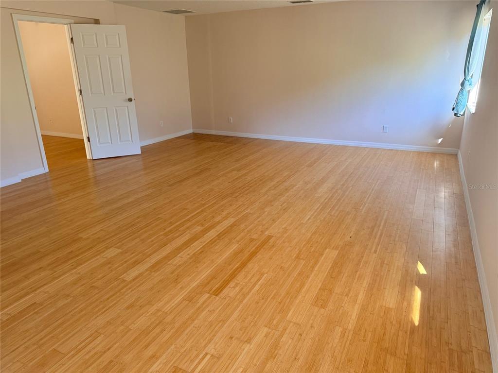 963 North Jacks Lake Road Clermont, FL 34711 - Photo 32 of 39 wooden floor in an empty room