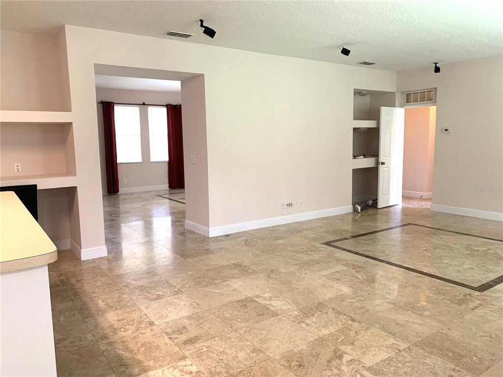 963 North Jacks Lake Road Clermont, FL 34711 - Photo 7 of 28 a view of a hallway with wooden floor and entryway