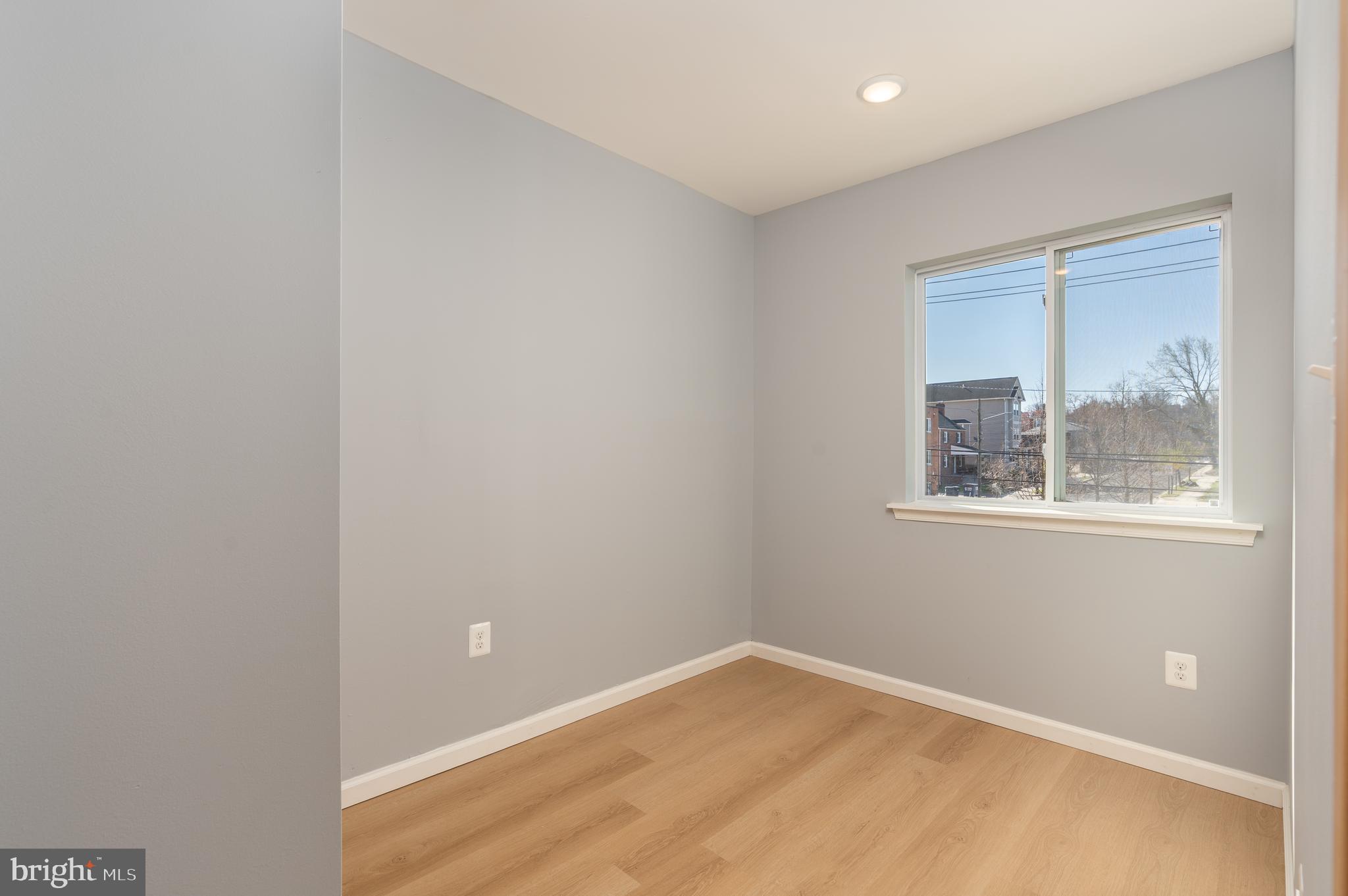4936 Nash Street Northeast, Unit 9 Washington, DC 20019 - Photo 7 of 17 a view of an empty room with a window