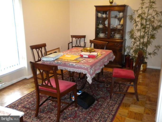 200 Cross Keys Road, Unit 58 Baltimore, MD 21210 - Photo 4 of 11 a dining room with a table and chairs