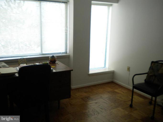 200 Cross Keys Road, Unit 58 Baltimore, MD 21210 - Photo 8 of 11 a room that has a window and a chair in it
