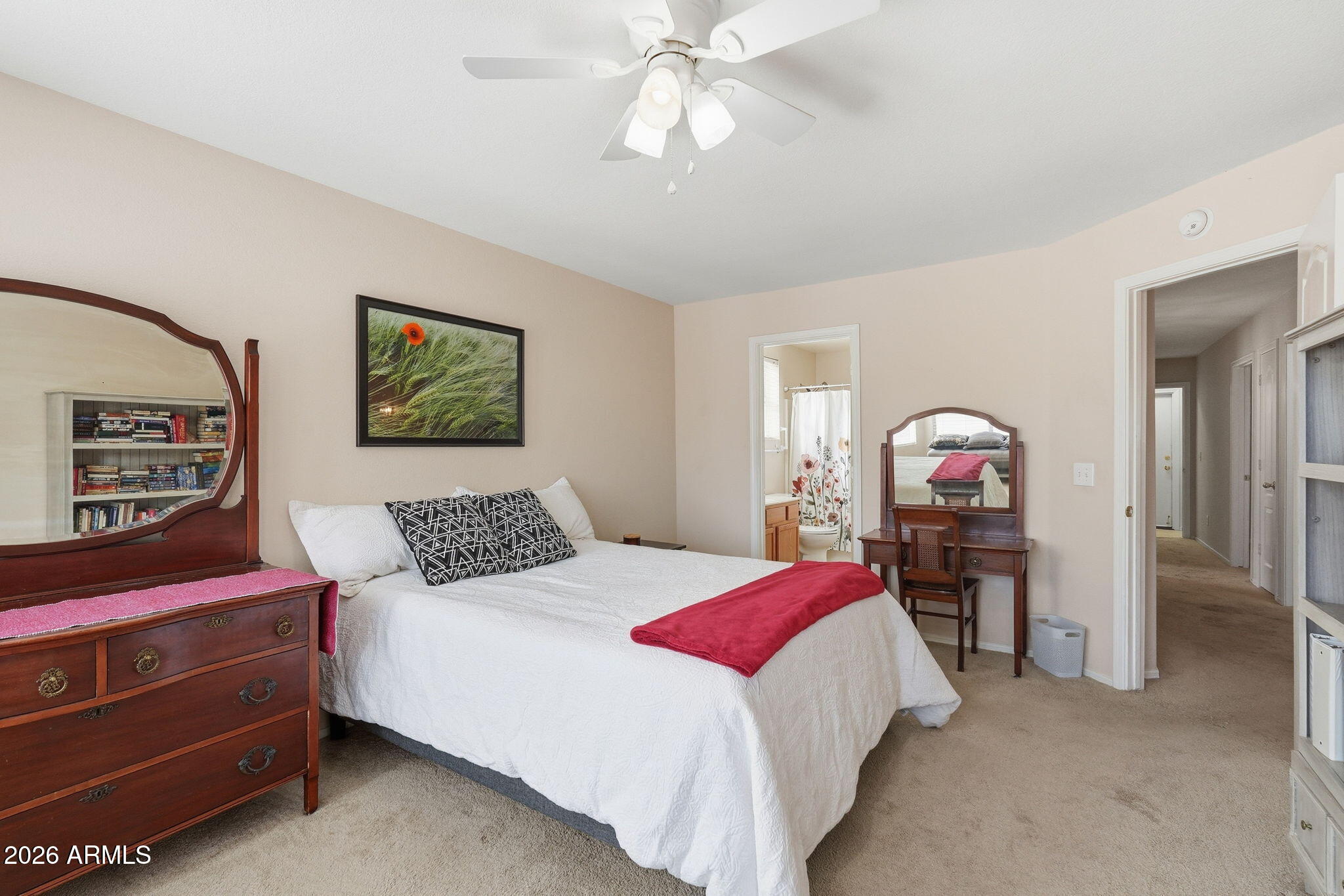 1405 West 15th Lane Apache Junction, AZ 85120 - Photo 19 of 33 a bedroom with a bed a dresser and painting