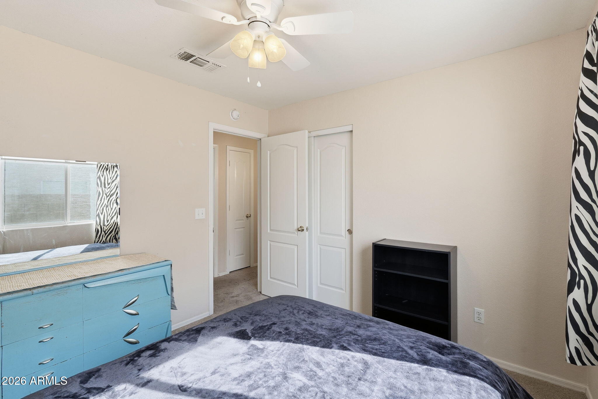 1405 West 15th Lane Apache Junction, AZ 85120 - Photo 24 of 33 a bedroom with a bed and a dresser
