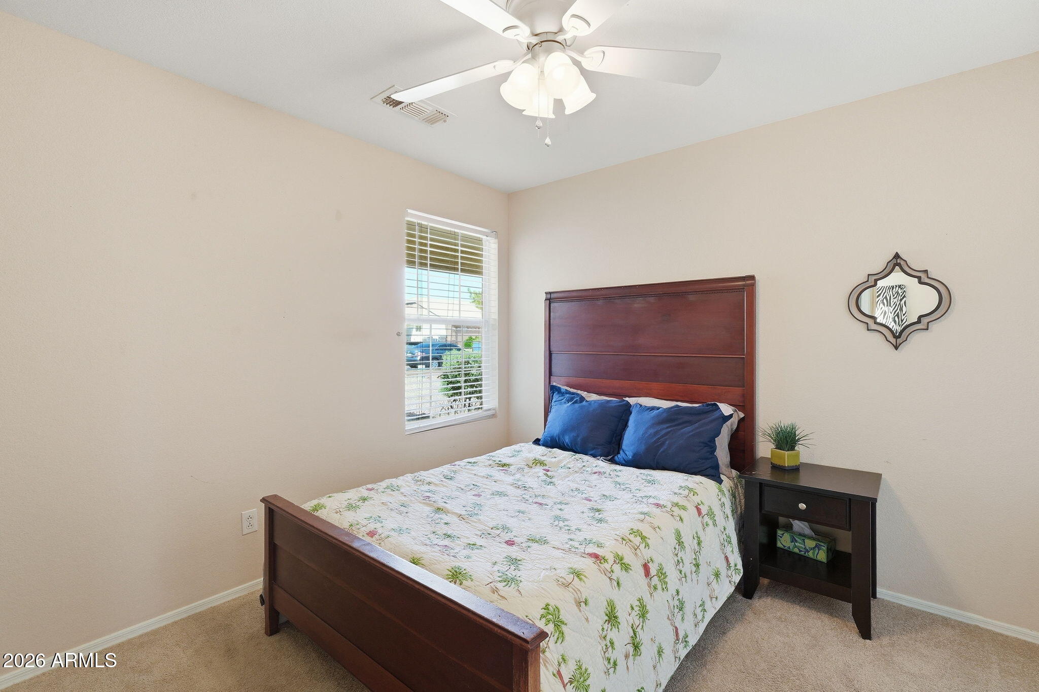1405 West 15th Lane Apache Junction, AZ 85120 - Photo 25 of 33 a bedroom with a bed and a window